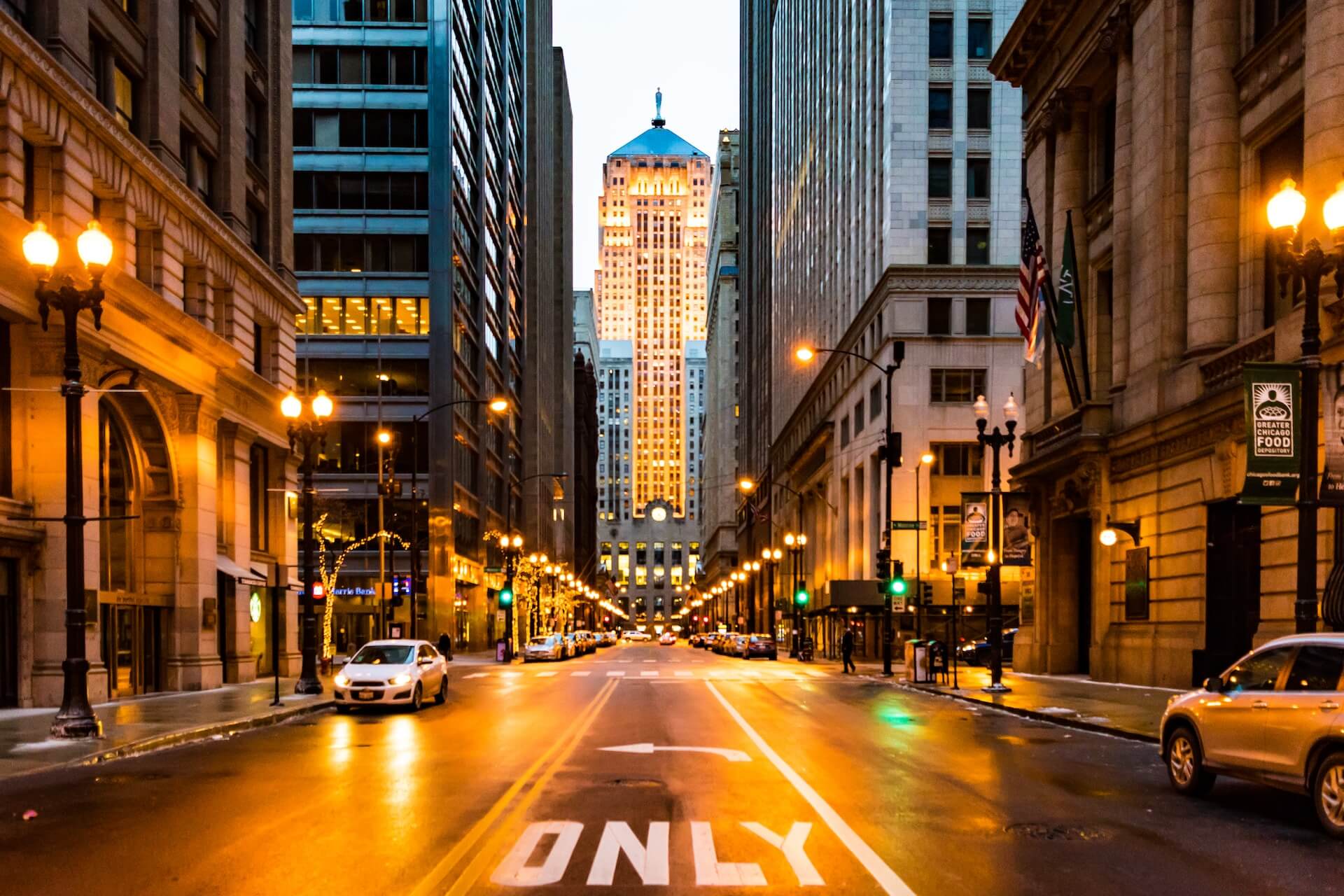 Lighted roadway surrounded with buildings in downtown Chicago